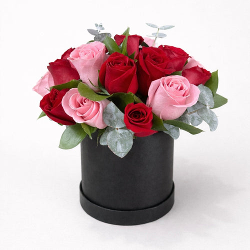Caja 12 rosas rojas y rosas